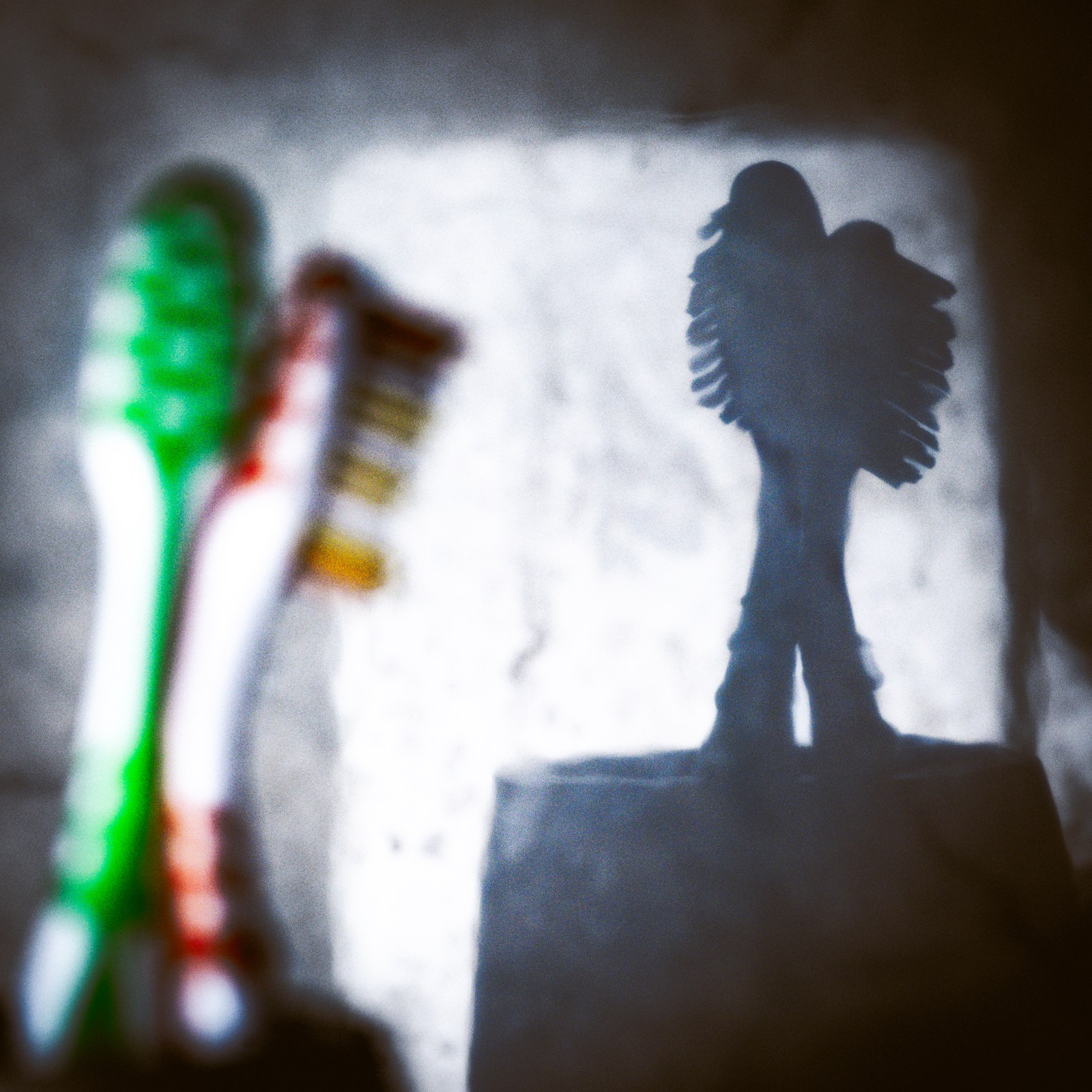 calm, muted colours, silhouette, texture, toothbrushes