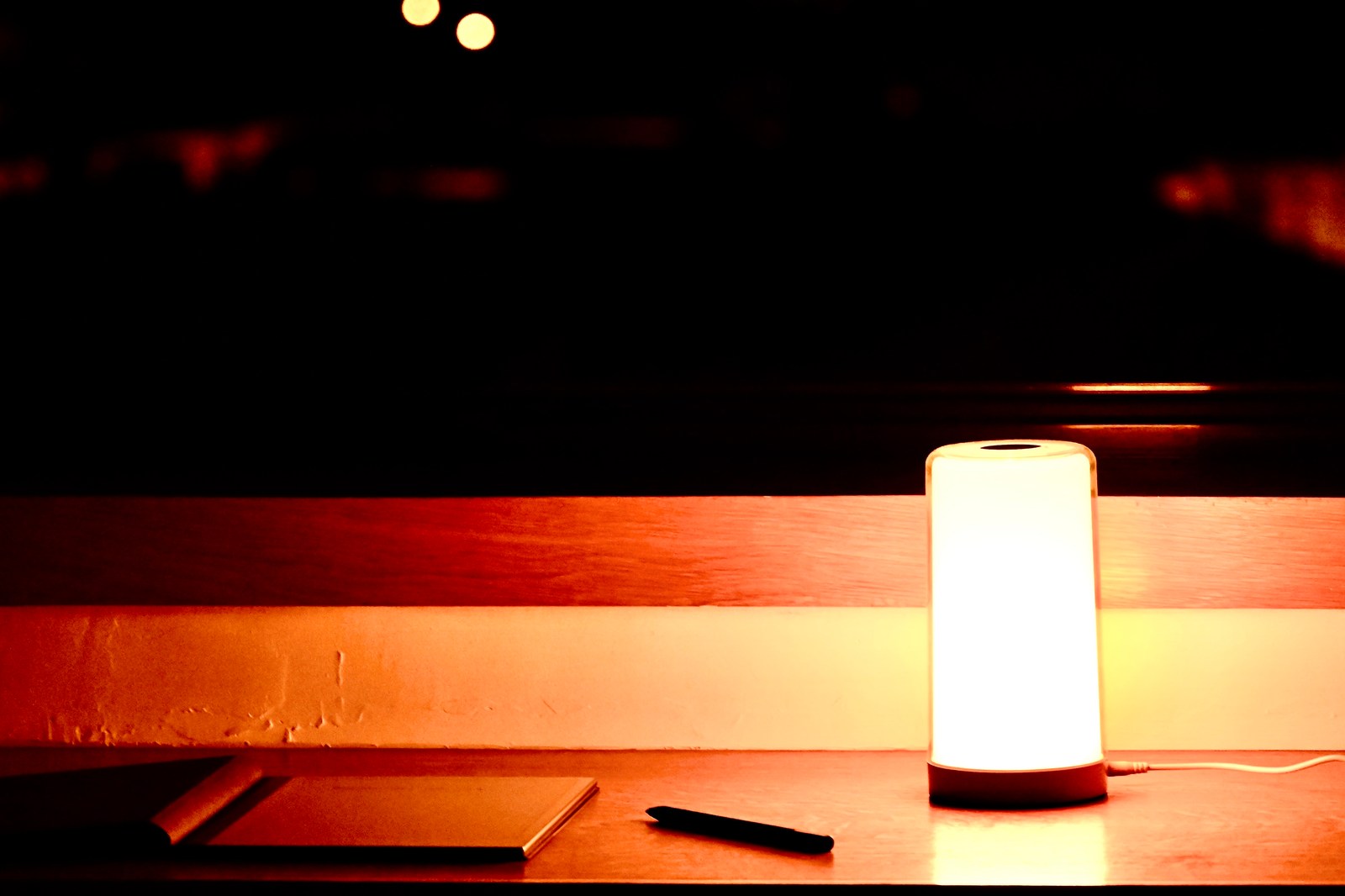 calm, lamp, night, notebook, pen, silhouette, solitude, warm light